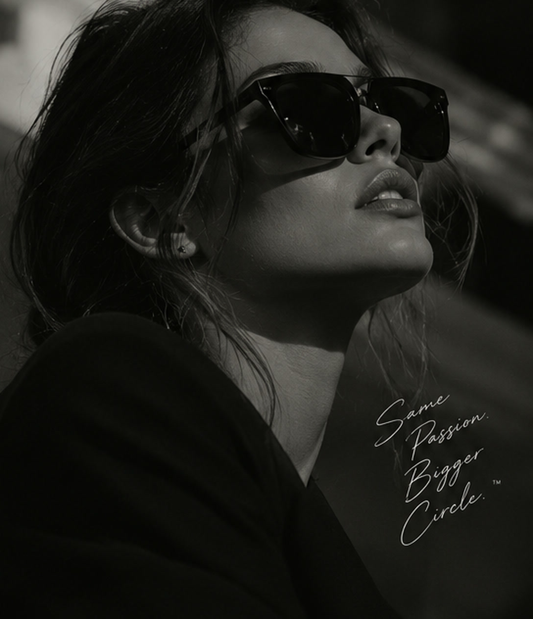 A woman in sunglasses looking up, over the words: same passion, bigger circle.